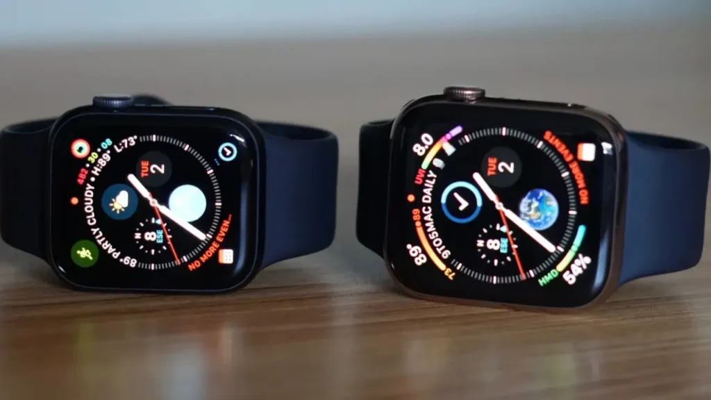 Two Apple Watches on a Wooden Surface Showing Different Faces - How To Change Apple Watch Face?